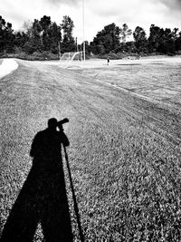 Shadow of man on field