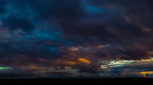 Low angle view of dramatic sky during sunset