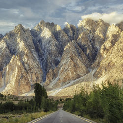 Panoramic view of road amidst mountains against sky