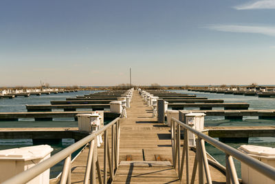 Pier over sea against sky