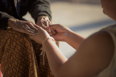 Close-up of man holding hands