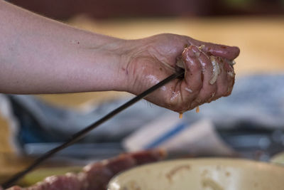 Close-up of hand holding ice cream