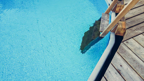 High angle view of ladder at swimming pool