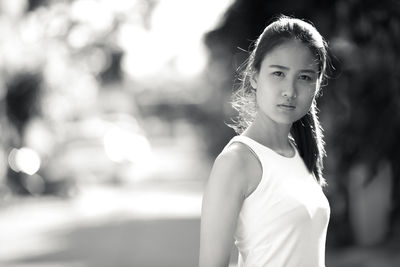 Portrait of woman standing outdoors