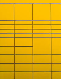 Full frame shot of yellow packing station 