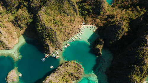 Lagoons and coves with blue water among the rocks. lagoon, kayangan covered with forests.