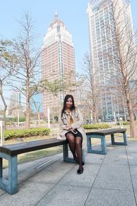 Portrait of woman sitting in park