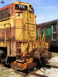 Abandoned train on railroad track against sky