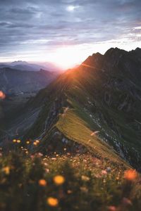 Scenic view of mountains against sky during sunset