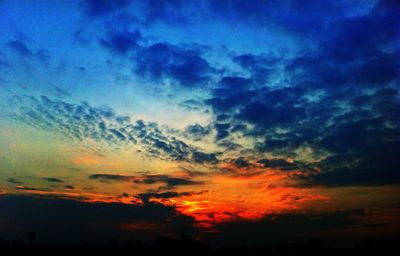 Low angle view of dramatic sky during sunset