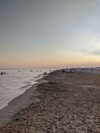 Scenic view of beach against sky during sunset