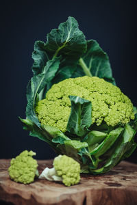 Close-up of vegetables on table against black background