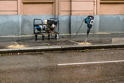 Geny and automatic hammer. infrastructure repairs equipment by the side of the road. 