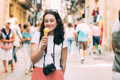 Portrait of woman eating ice cream