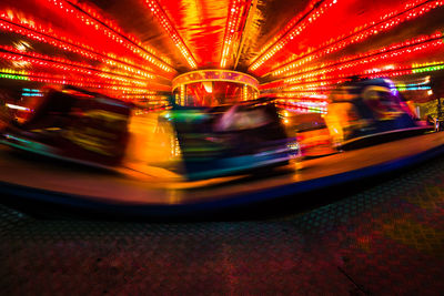 Illuminated carousel in amusement park