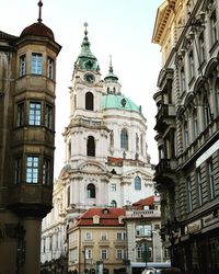 Low angle view of buildings in city against sky