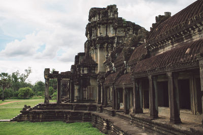 Old ruins of temple against cloudy sky