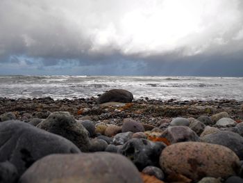 Scenic view of sea against cloudy sky