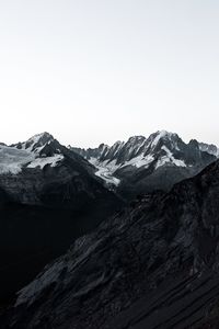 Scenic view of snowcapped mountains against clear sky