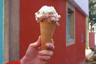 Hand holding ice cream cone