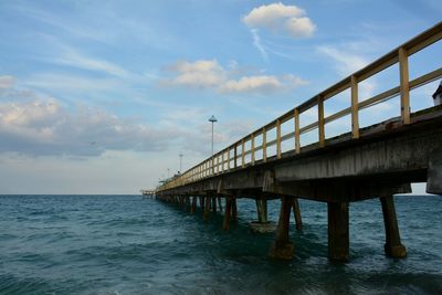 Pier over sea against sky