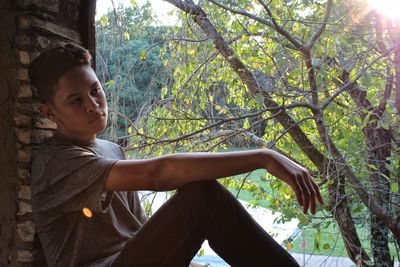 Full length of young woman in forest