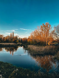 Scenic view of lake against sky during autumn