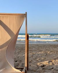 Scenic view of beach against clear sky