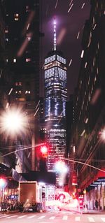 Illuminated modern buildings in city at night