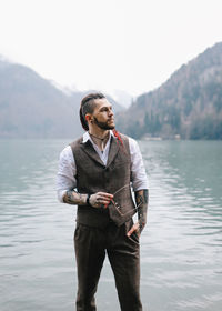 Young man looking at lake