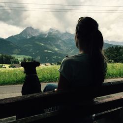 Woman looking at mountain landscape