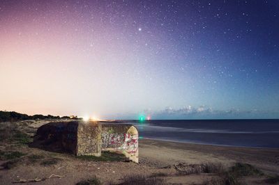 Scenic view of sea against sky at night