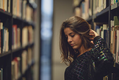 Young woman looking at book