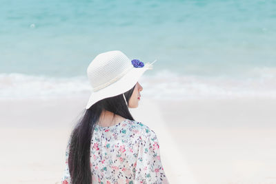 Happy woman hat enjoy summer vacation on the beach.