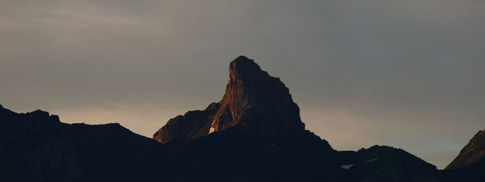 Low angle view of silhouette mountain against sky during sunset