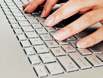 Close-up of hands using mobile phone