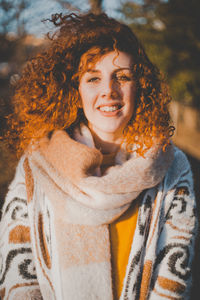 Close-up portrait of smiling young woman