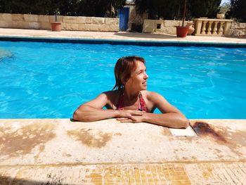 Young woman at poolside