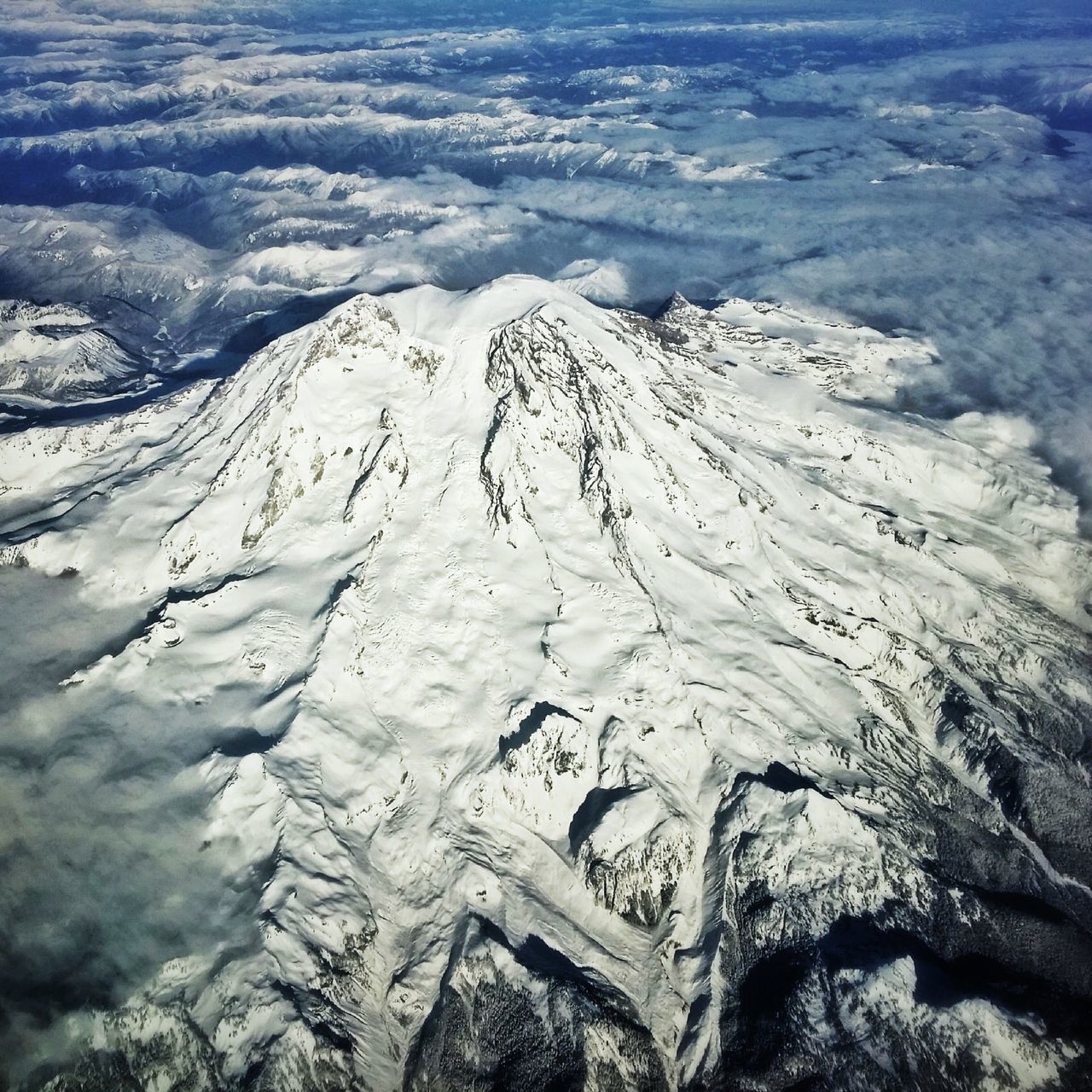 snow, winter, cold temperature, mountain, tranquility, tranquil scene, scenics, beauty in nature, season, landscape, nature, weather, mountain range, high angle view, covering, snowcapped mountain, non-urban scene, idyllic, frozen, sky