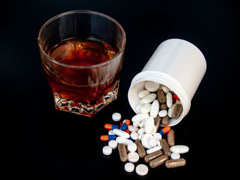 High angle view of drink on table against black background