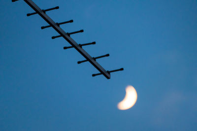 Low angle view of helicopter flying in sky