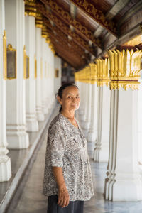 Portrait of woman standing in building