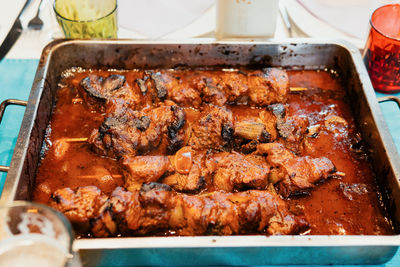 High angle view of meat on barbecue grill