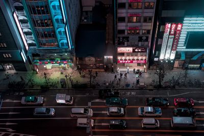 High angle view of traffic in illuminated city at night