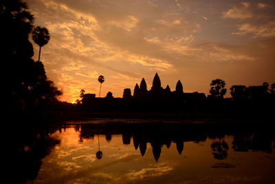 Silhouette of temple against sky during sunset