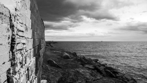 Scenic view of sea against cloudy sky