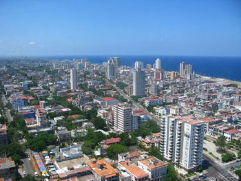 High angle view of buildings in city against sky
