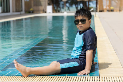 Boy happy swimming in a pool. children swimming and playing in water.