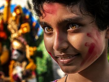 Close-up portrait of smiling young girl