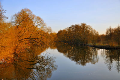 Scenic view of lake against sky during autumn